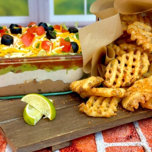taco dip with chili lime waffle fries