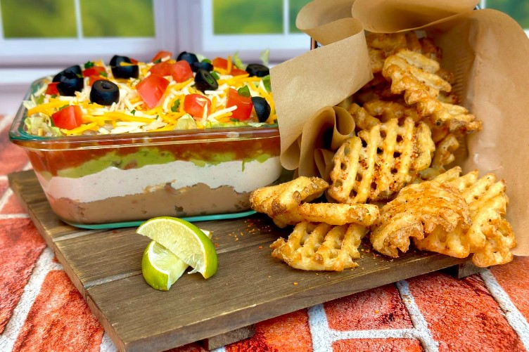 taco dip with chili lime waffle fries
